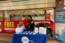 Two people run a stall for Citizen's Advice in Letchworth town centre