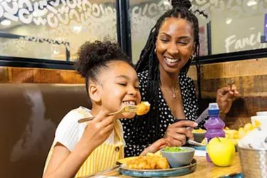 A mother and daughter enjoy food at Morrions Cafe.