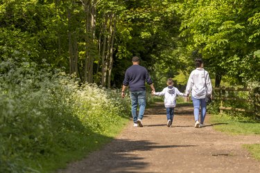A family walk through the woods next to Standalone Farm