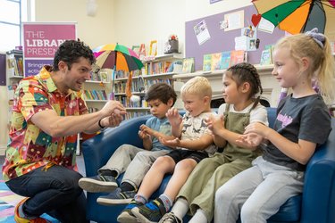 Author Chip Colquhoun reads to children at a library.