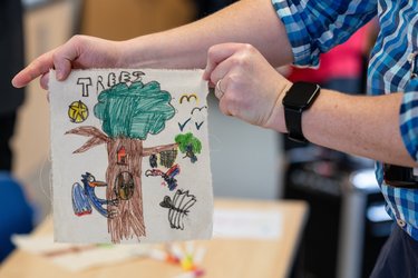 A child's artwork with a tree on it